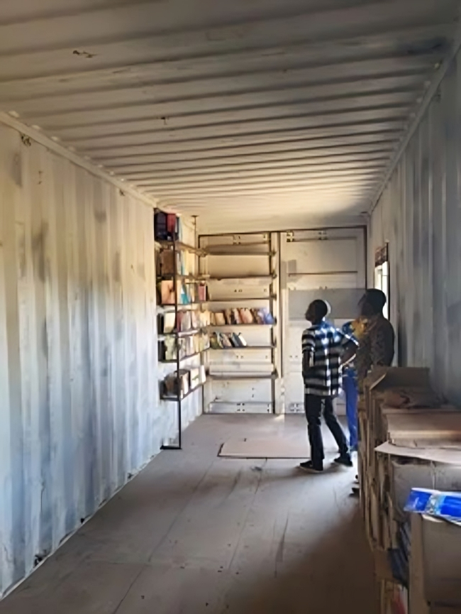 Empty cargo container used as a library in a Ugandan Bible College