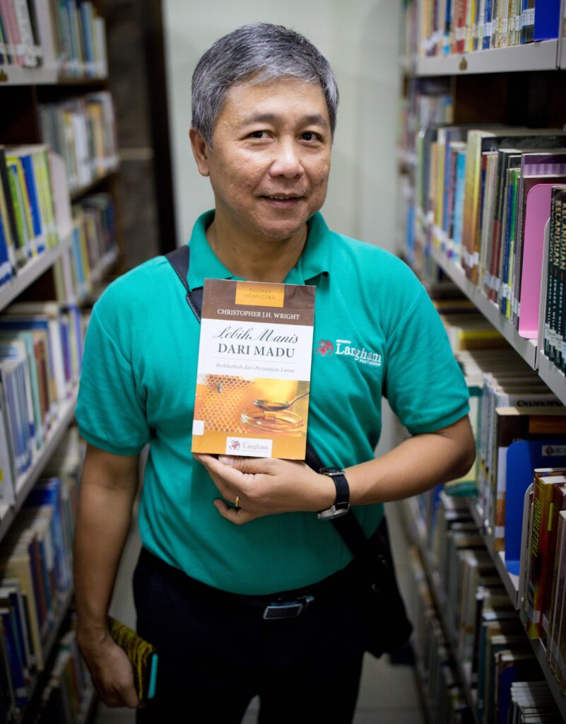 Hamdani Tedja with Chris Wright's book 'Sweeter than Honey' translated into Indonesian.